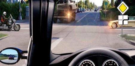 Which vehicle should you give way to when you continue driving straight ahead?