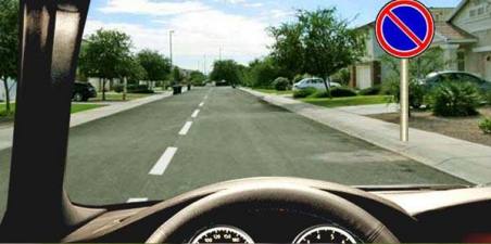 Which vehicles are allowed to park in the area of influence of the given road sign?