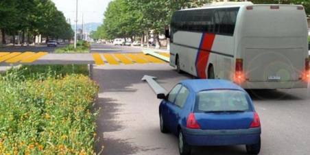 What should the driver of a car do if the bus driver starts to brake?