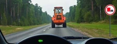 Is it allowed for a truck driver to overtake a tractor if the maximum permissible mass is 3 tons?