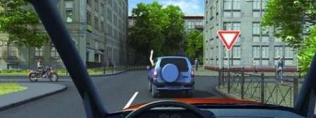 The driver with a hand stretched up warns